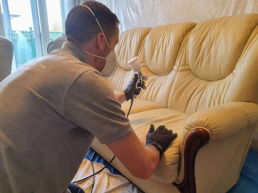Advanced leather factory finish applying new clear coat to leather